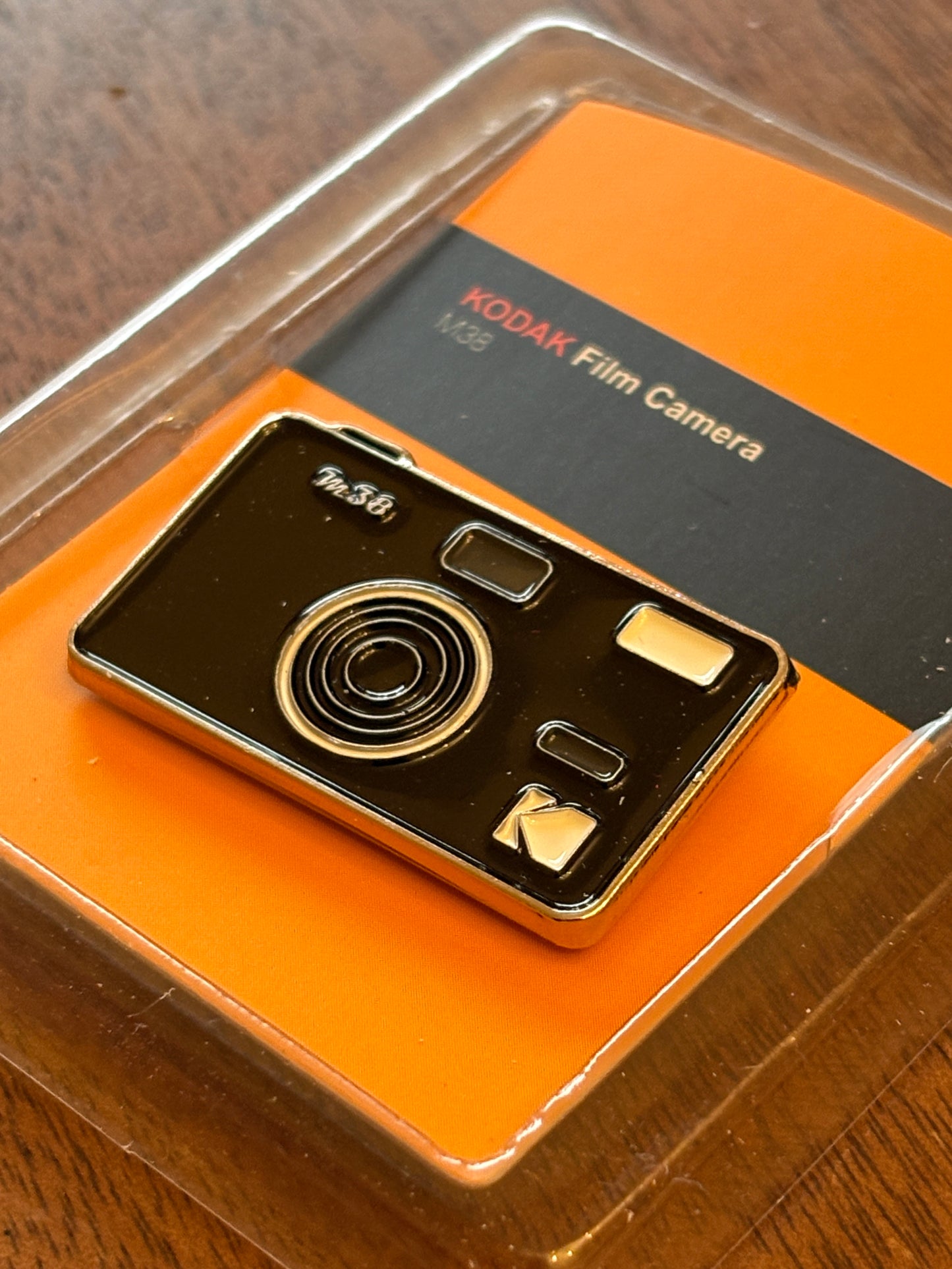 very rare  Kodak M38 pin badge black